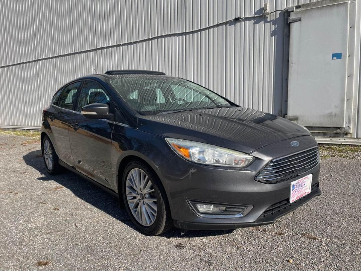 2015 Grey /Black Ford Focus Titanium (1FADP3N26FL) with an 2.0 4 CYL engine, Auto transmission, located at 5700 Curlew Drive, Norfolk, VA, 23502, (757) 455-6330, 36.841885, -76.209412 - Photo#1